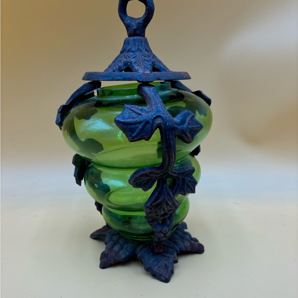 Green art glass and wrought iron candle holder